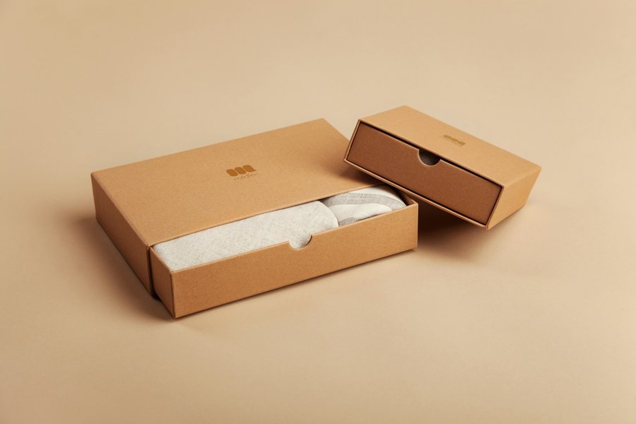 Open gift box with tissue paper ready to send to a creator